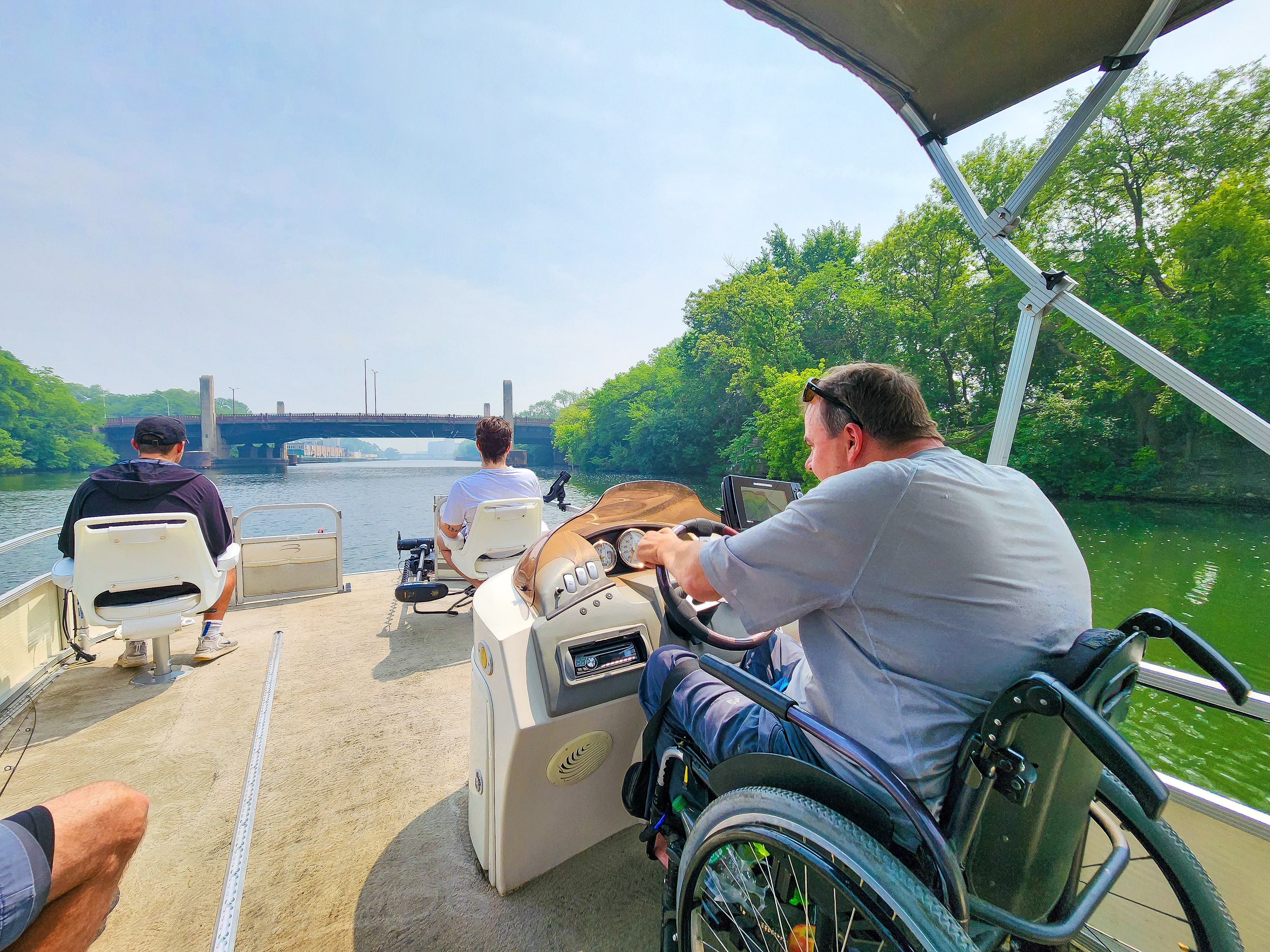 Dave Hanson guides the wheelchair accessible boat into Chicago