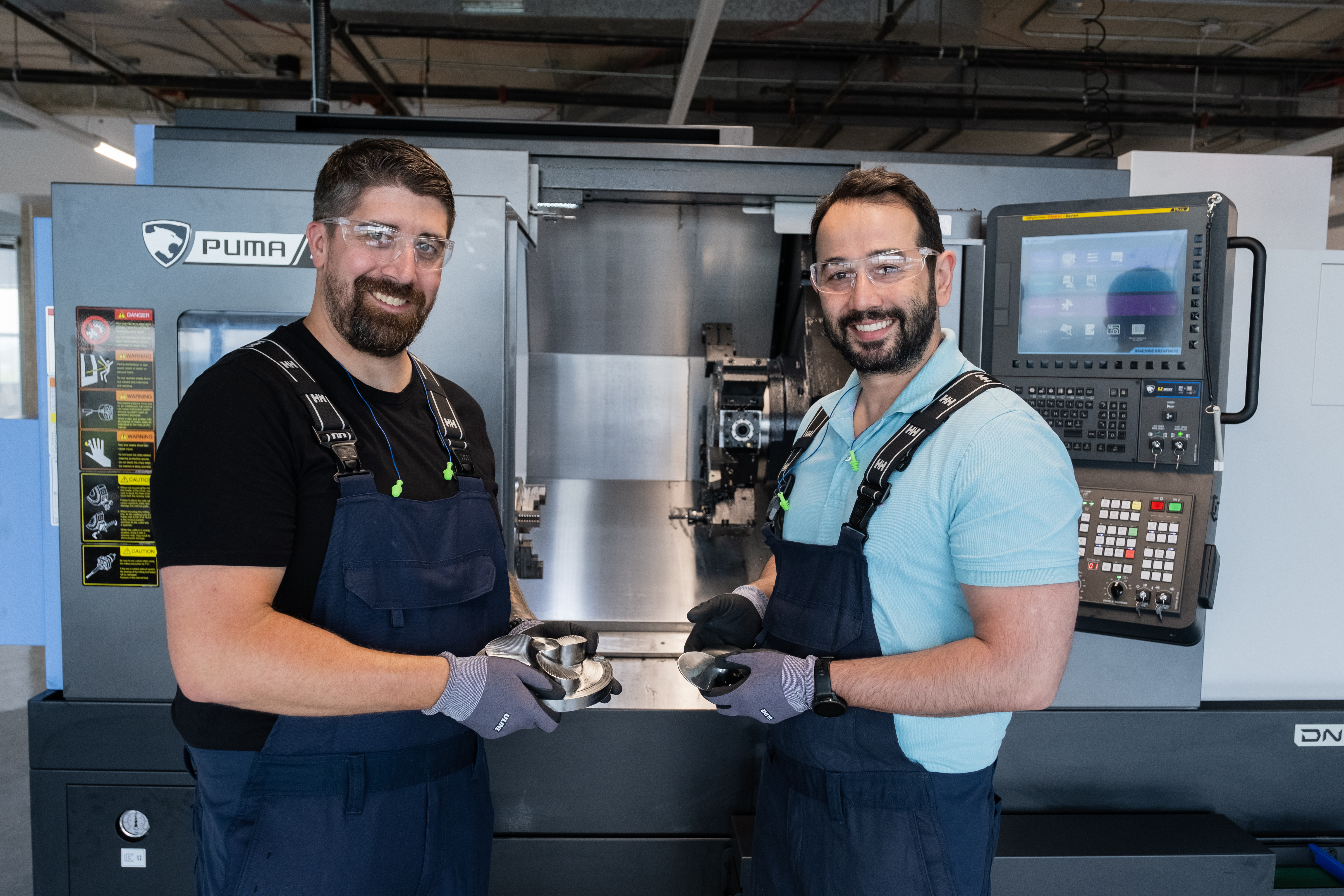 CEO and Managing Director Dr. Hamid Noori (right) with Manufacturing Supervisor Dan Gudgeon (left) holding the first bioreactor impeller from The Cultivated B.