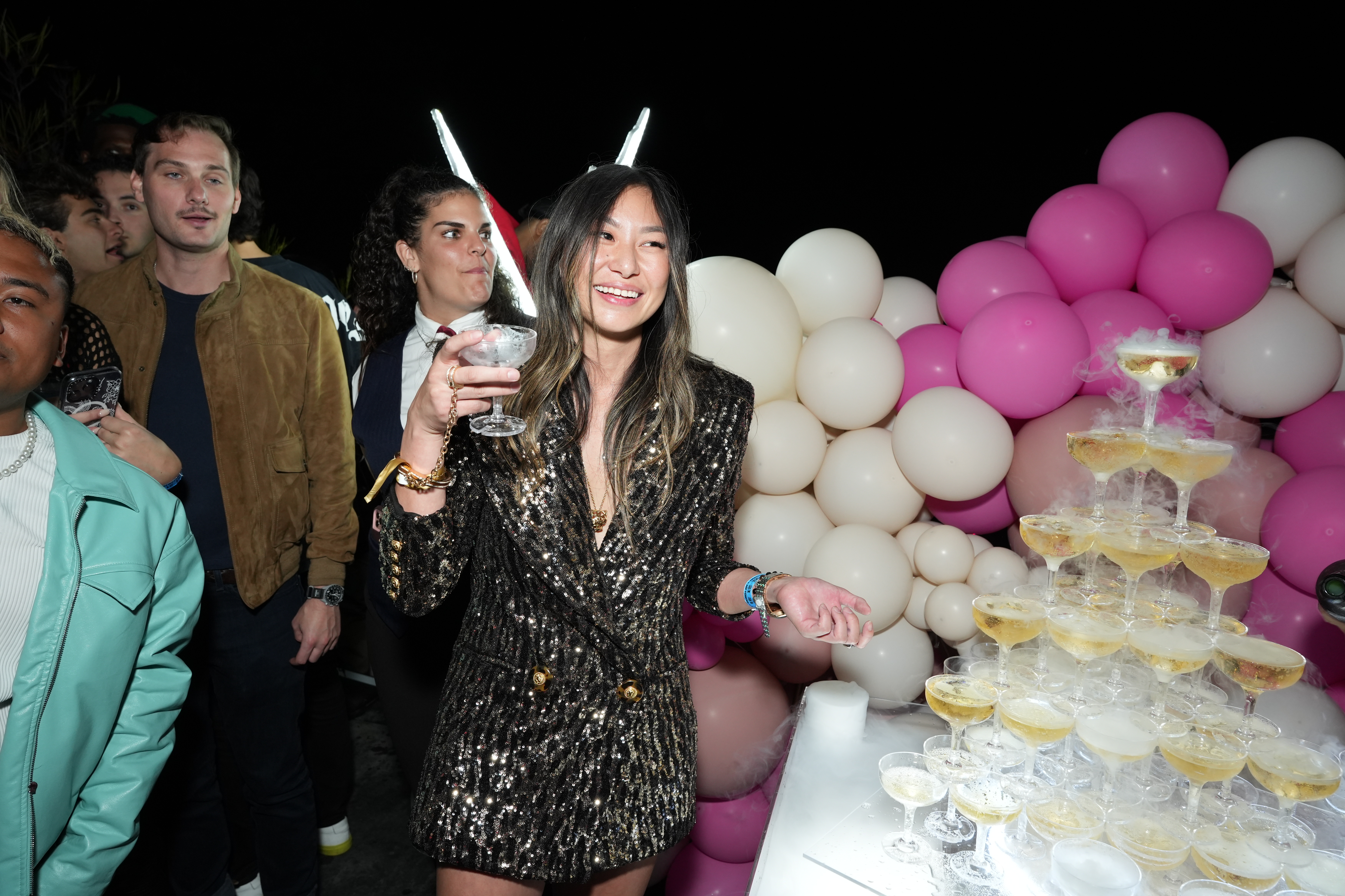 Passes&#39; CEO Lucy Guo celebrates with a champagne toast at her &#39;Lucypalooza&#39; birthday festival, presented by Le Bon Argent By Floyd Mayweather, sponsored by Flex &amp; Betr on October 12, in Los Angeles. (Photo by Gonzalo Marroquin/Getty Images)