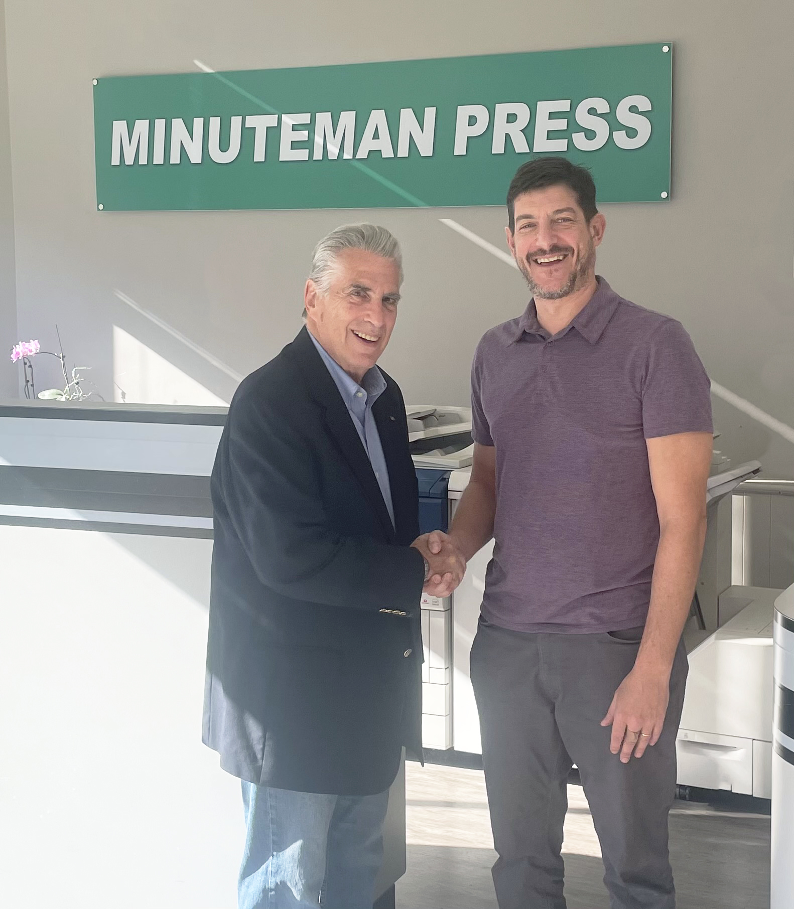 Alloy Printing owner Alan Goldman (now retired) with new Minuteman Press franchise owner Chris Greene. Alloy Printing is now Minuteman Press, White Plains, NY.
