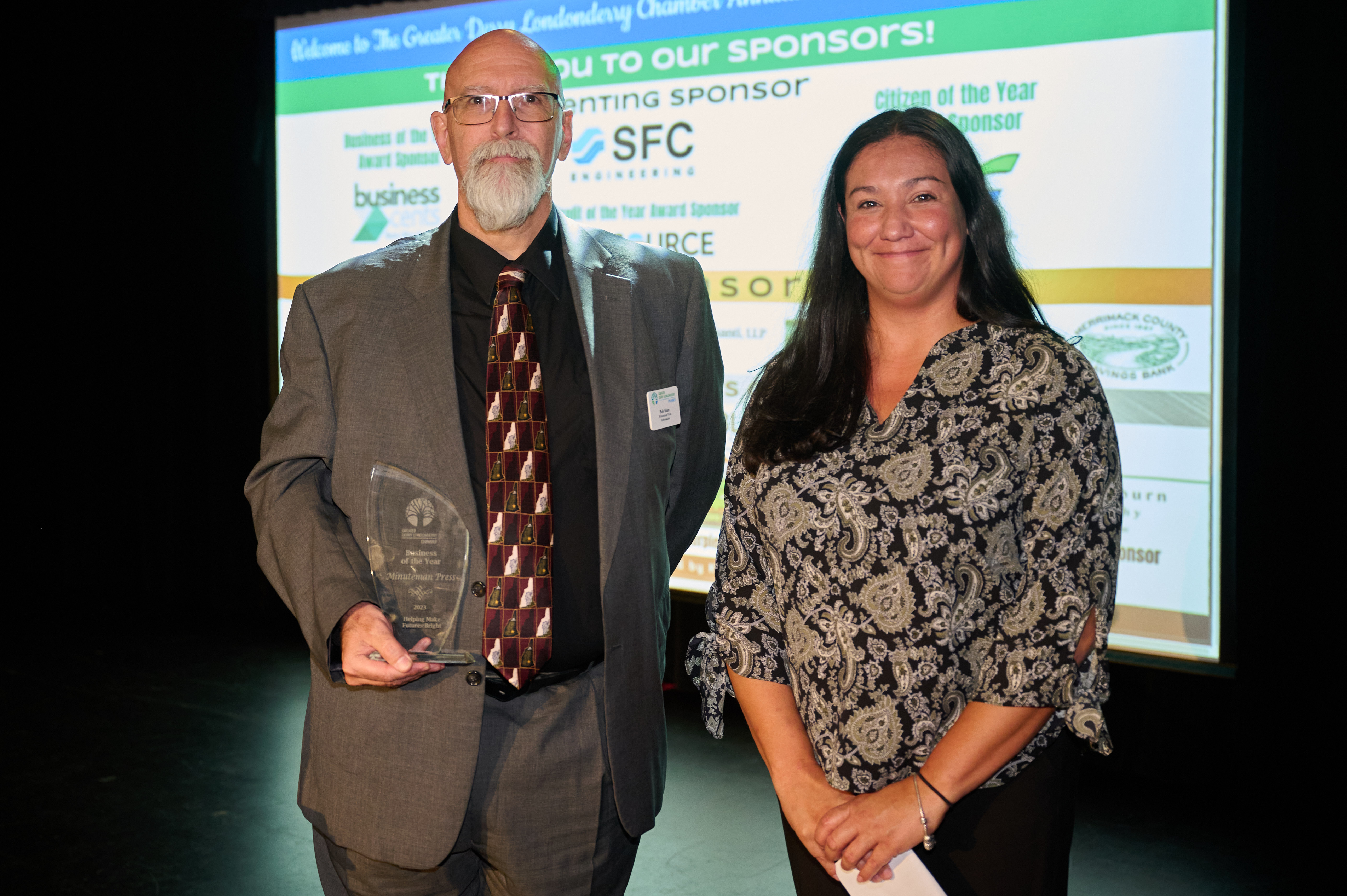 Minuteman Press franchise owner Bob Bean (left) accepts his award for Business of the Year on Oct. 12, 2023.