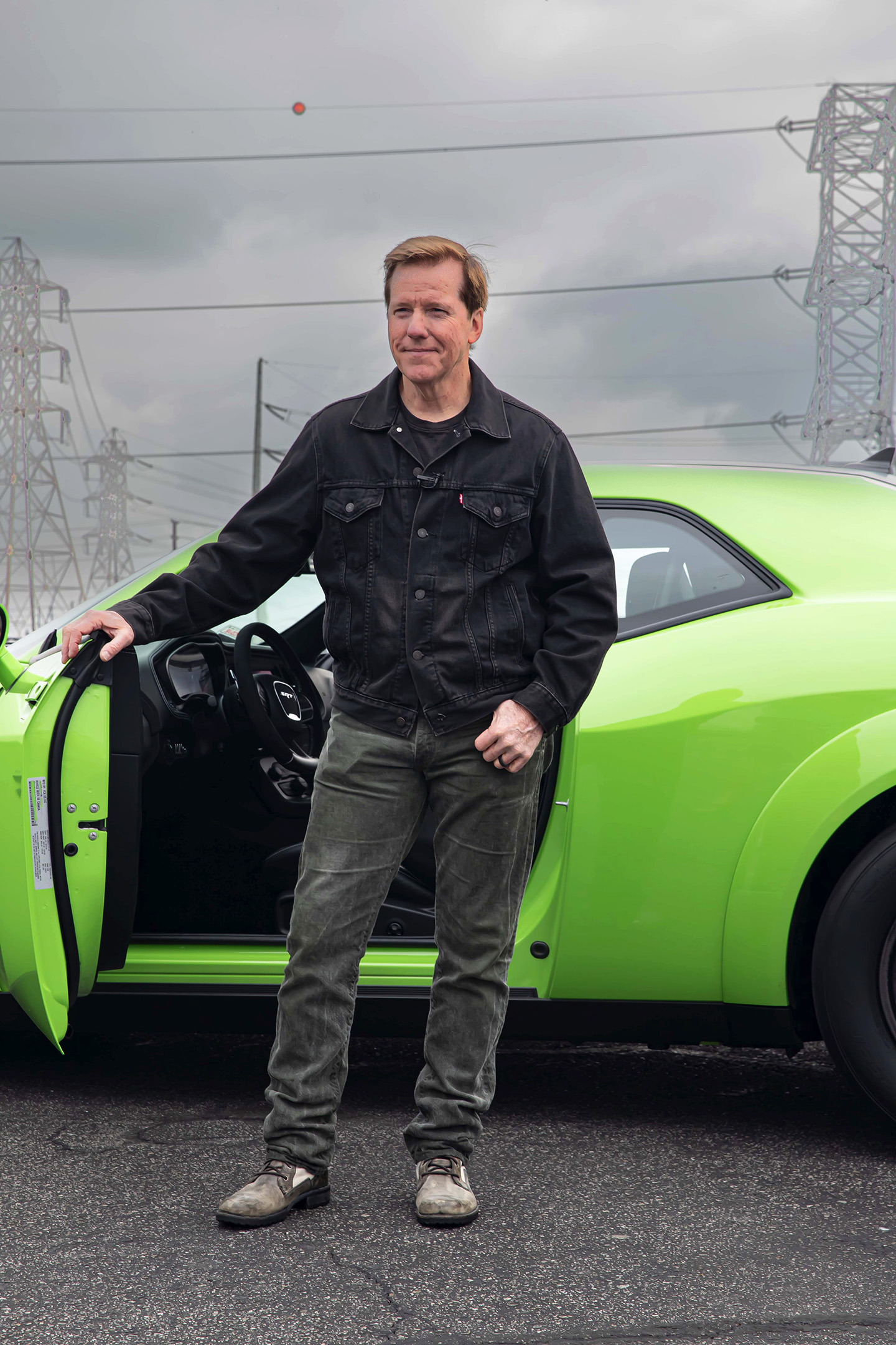 Jeff Dunham with his Direct Connection-equipped Dodge Challenger SRT Demon 170 after pulling wheelies at the drag strip