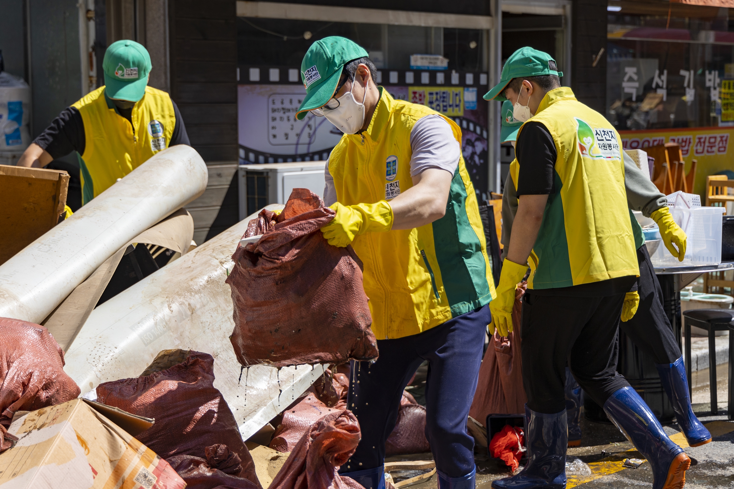 Members of the Shincheonji Volunteer Group helping to repair damages locally affected by a typhoon