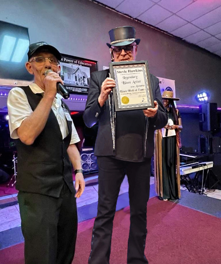 Jim Newport Blues Hall of Fame ambassador presents Stevie Hawkins Legendary Blues Artist plaque