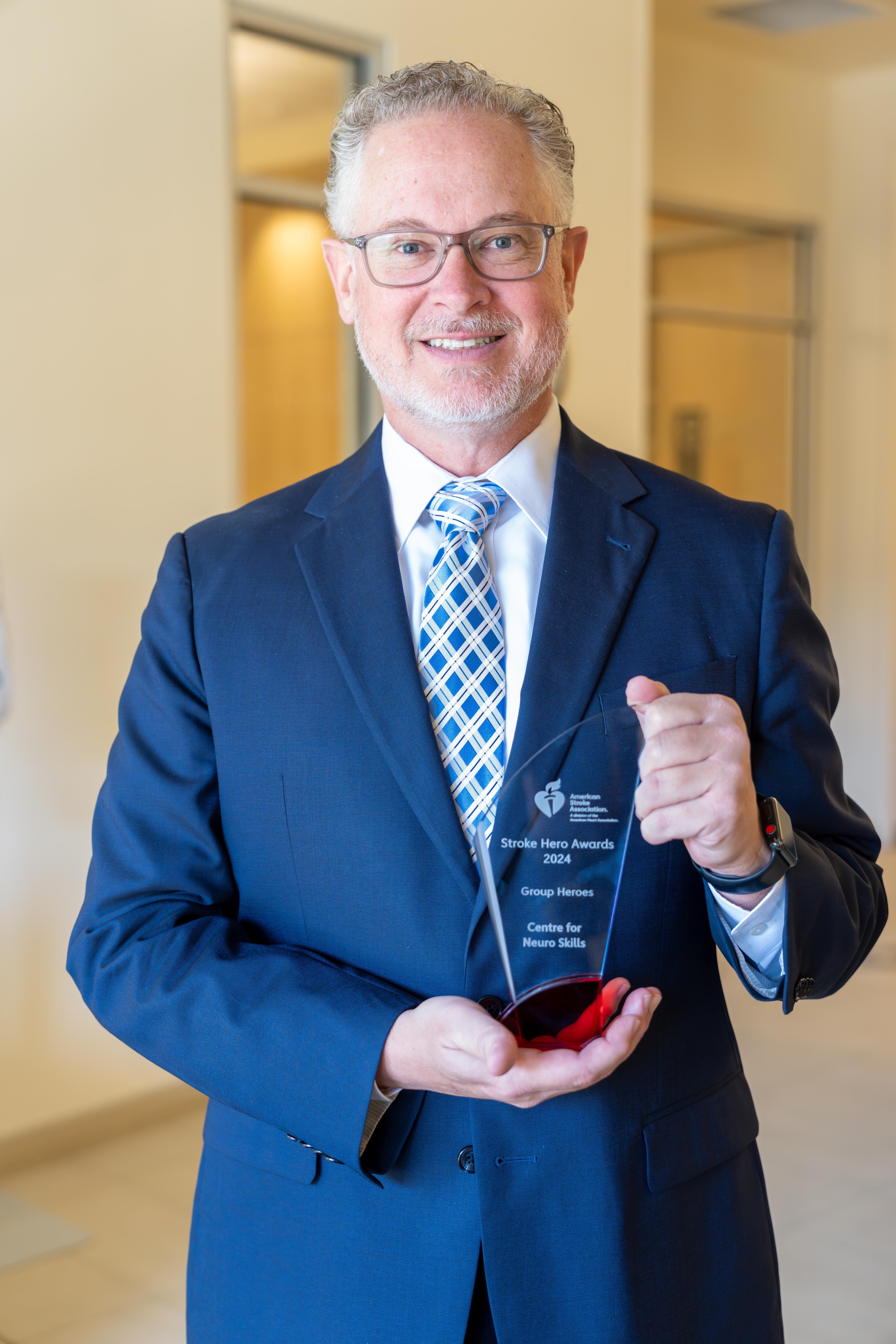 David Harrington, President and Chief Executive Officer of Centre for Neuro Skills, with the 2024 American Heart Association Group Stroke Hero award